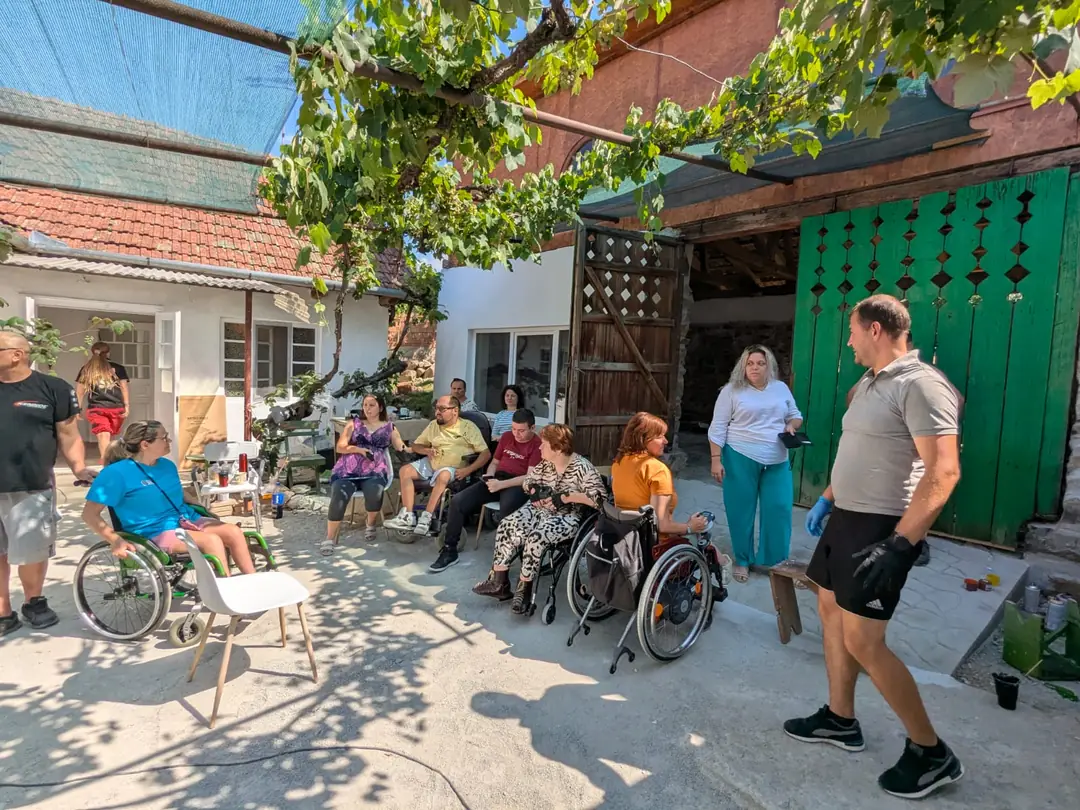 The yard of the Friendship House, full of people