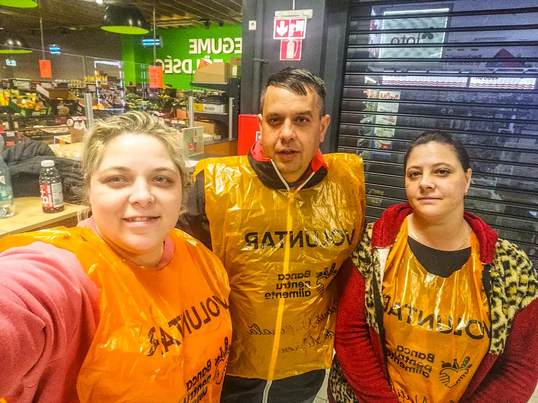 Volunteers at a food drive in a supermarket